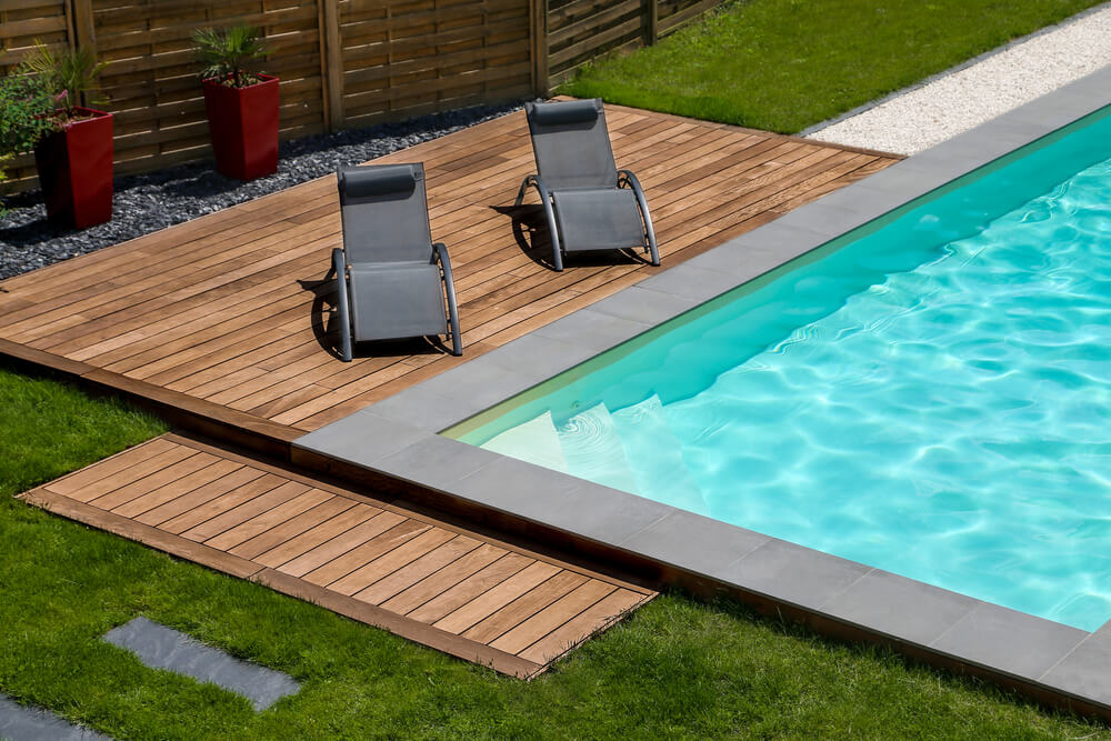 Beautiful Swimming Pool and Exotic Wooden Terrace With Sunbath Chair