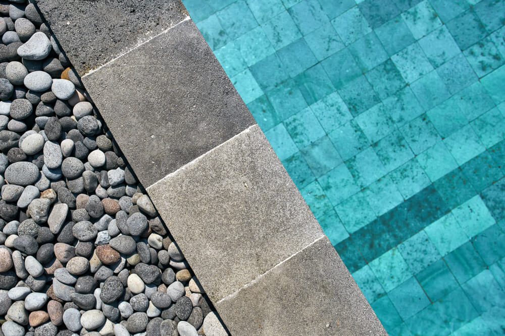 View From Above at a Swimming Pool With Blue Water Outdoors.