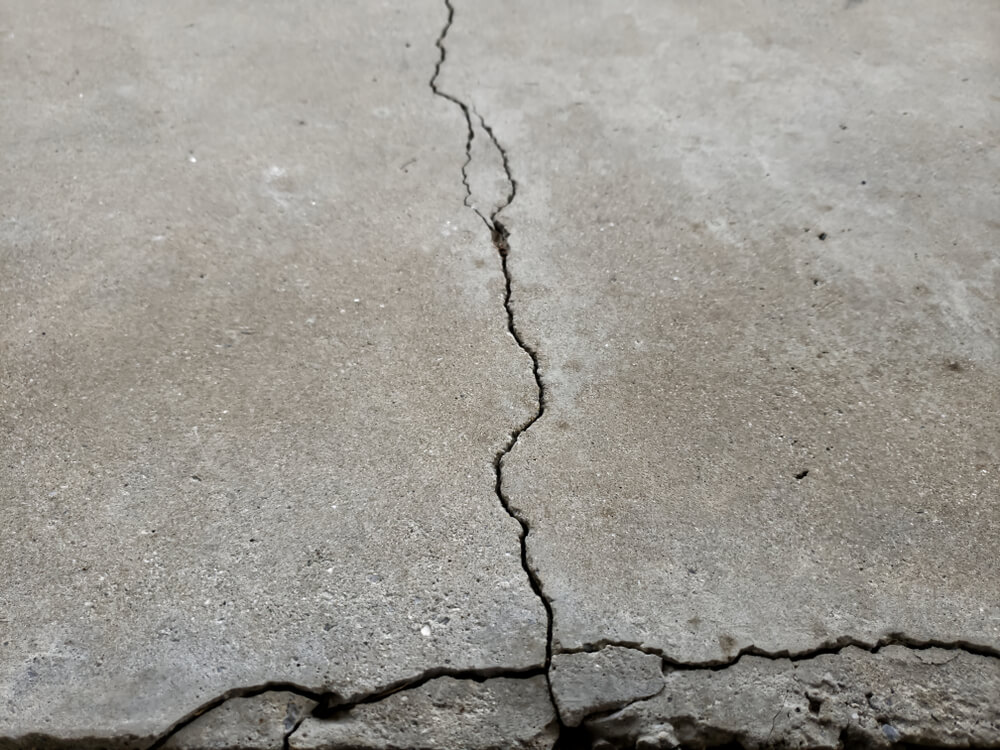 Examples of Cracked Foundations and Sidewalks or Driveways in Need of Foundation or Driveway Concrete Repair
