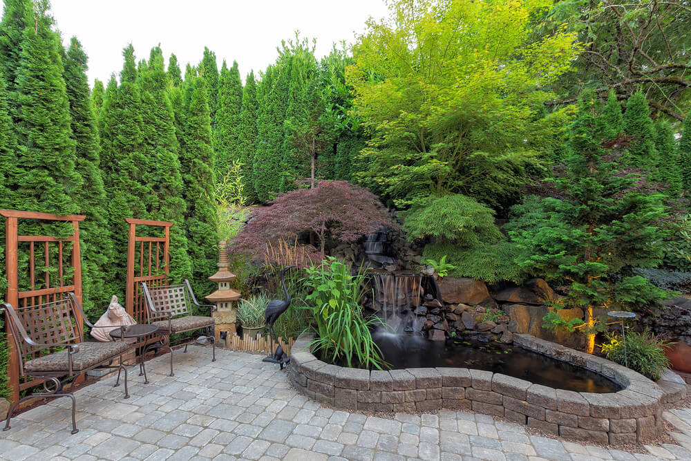 Backyard Garden Landscaping With Waterfall Pond Trees Plants Trellis Decor Patio Furniture Brick Pavers