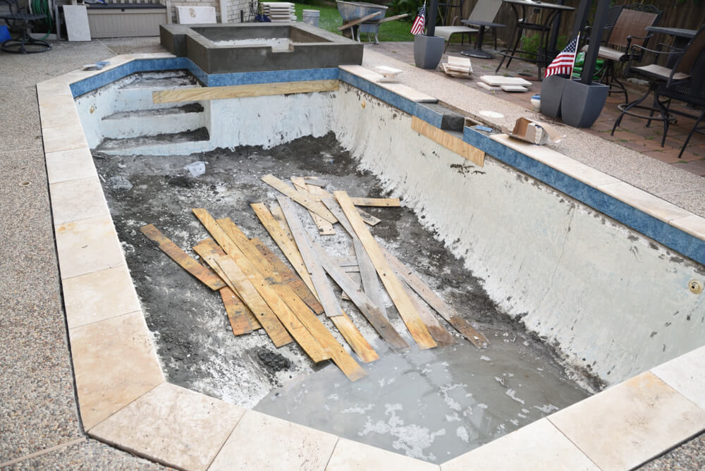 Pool Remodel With Construction Material and Trash