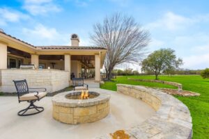 A patio with a firepit.